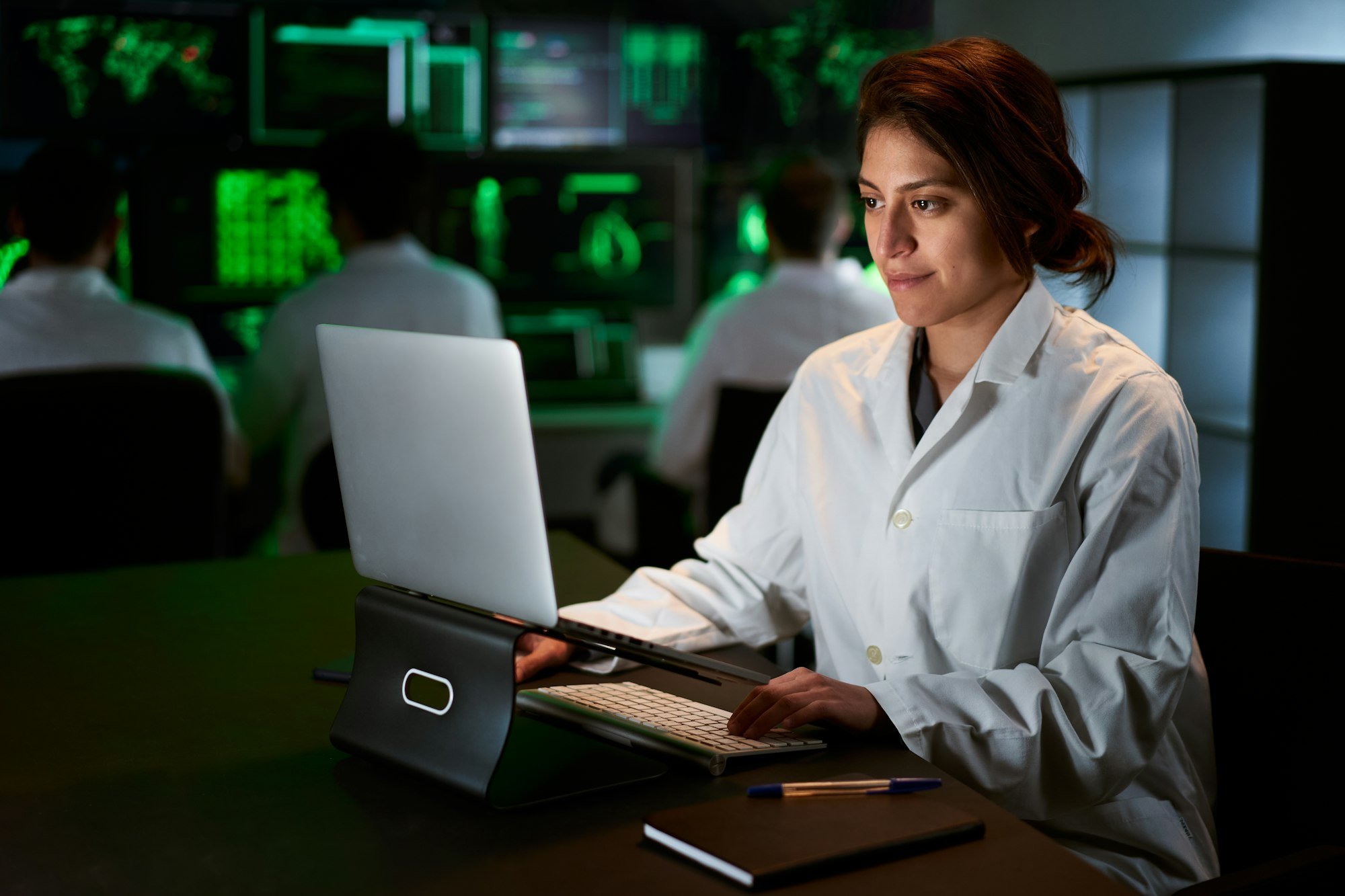 Female Medical Research Scientist using computer laptop. Neurologist Solving Puzzles of the Mind